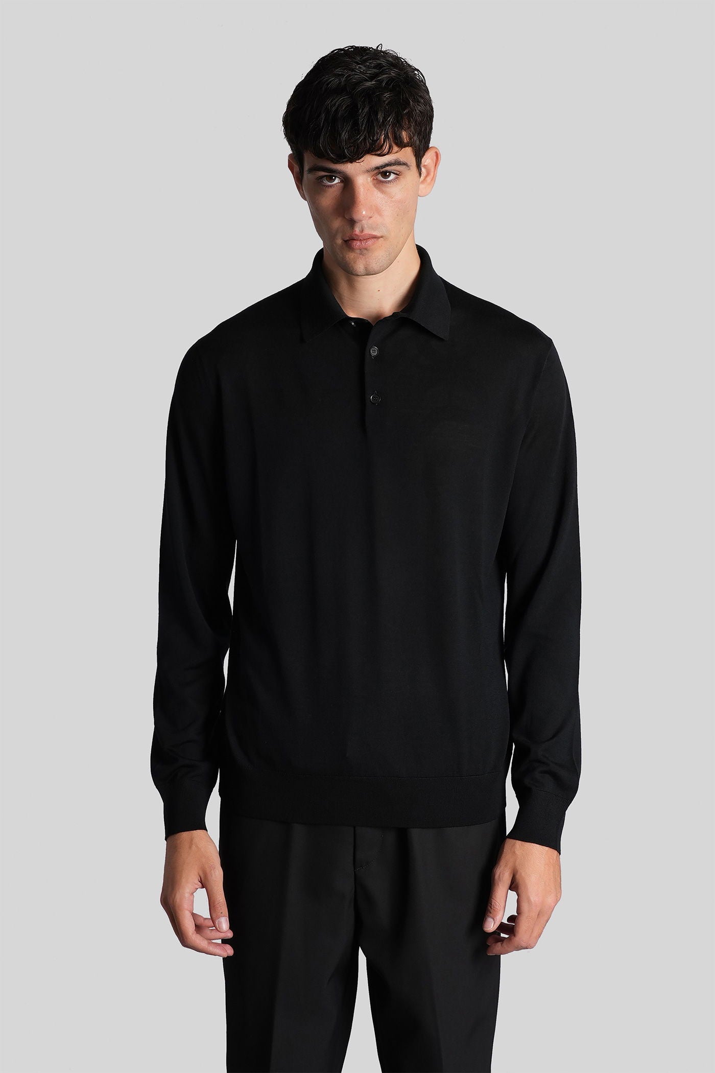 Polo in black wool