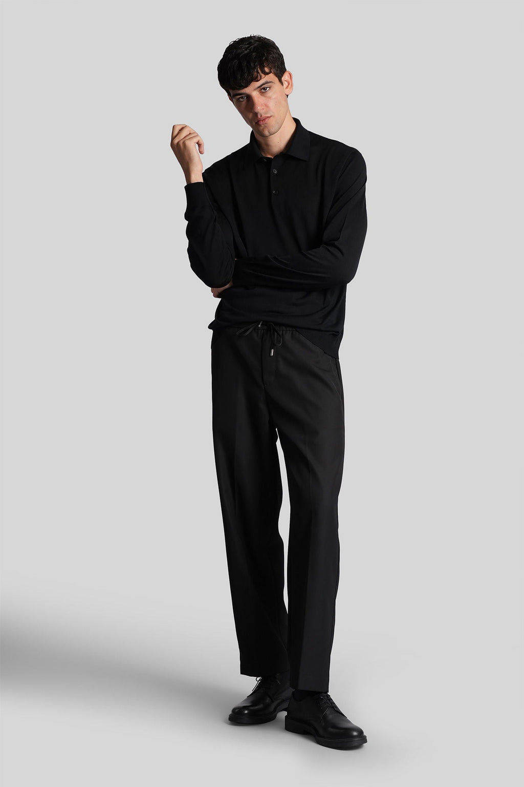 Polo in black wool