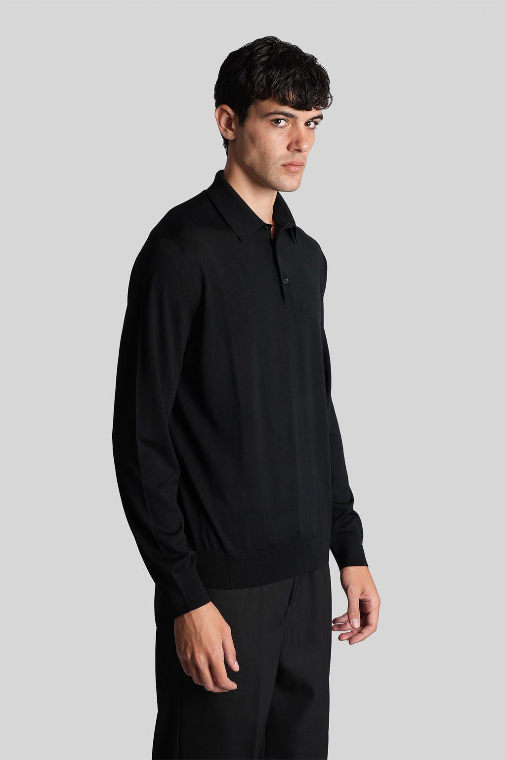 Polo in black wool