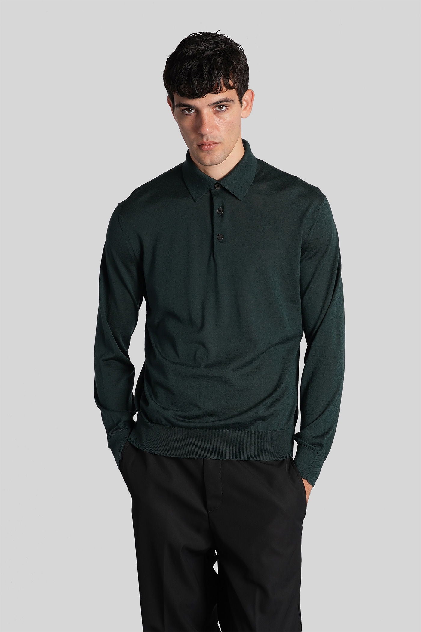 Polo in green wool
