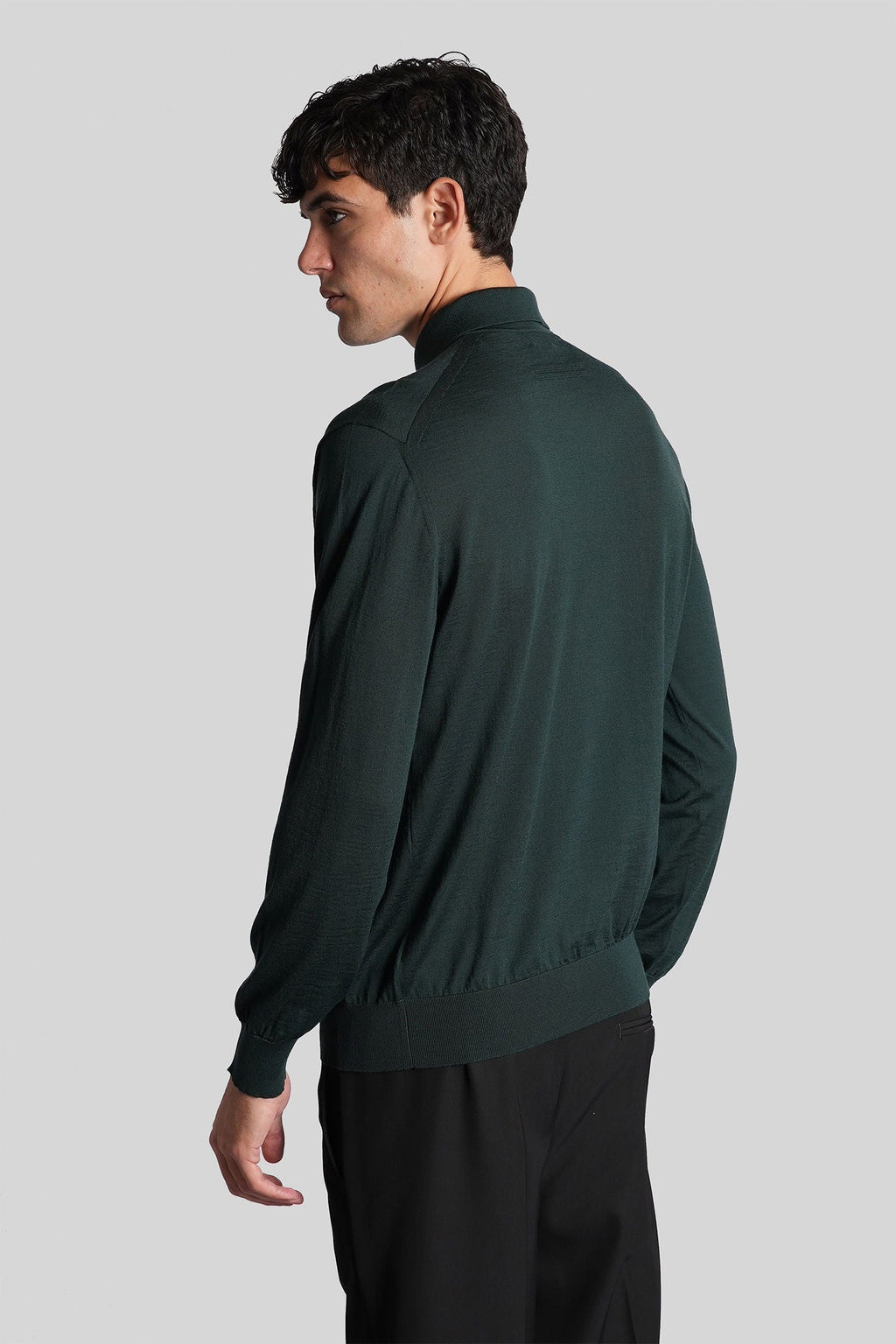 Polo in green wool