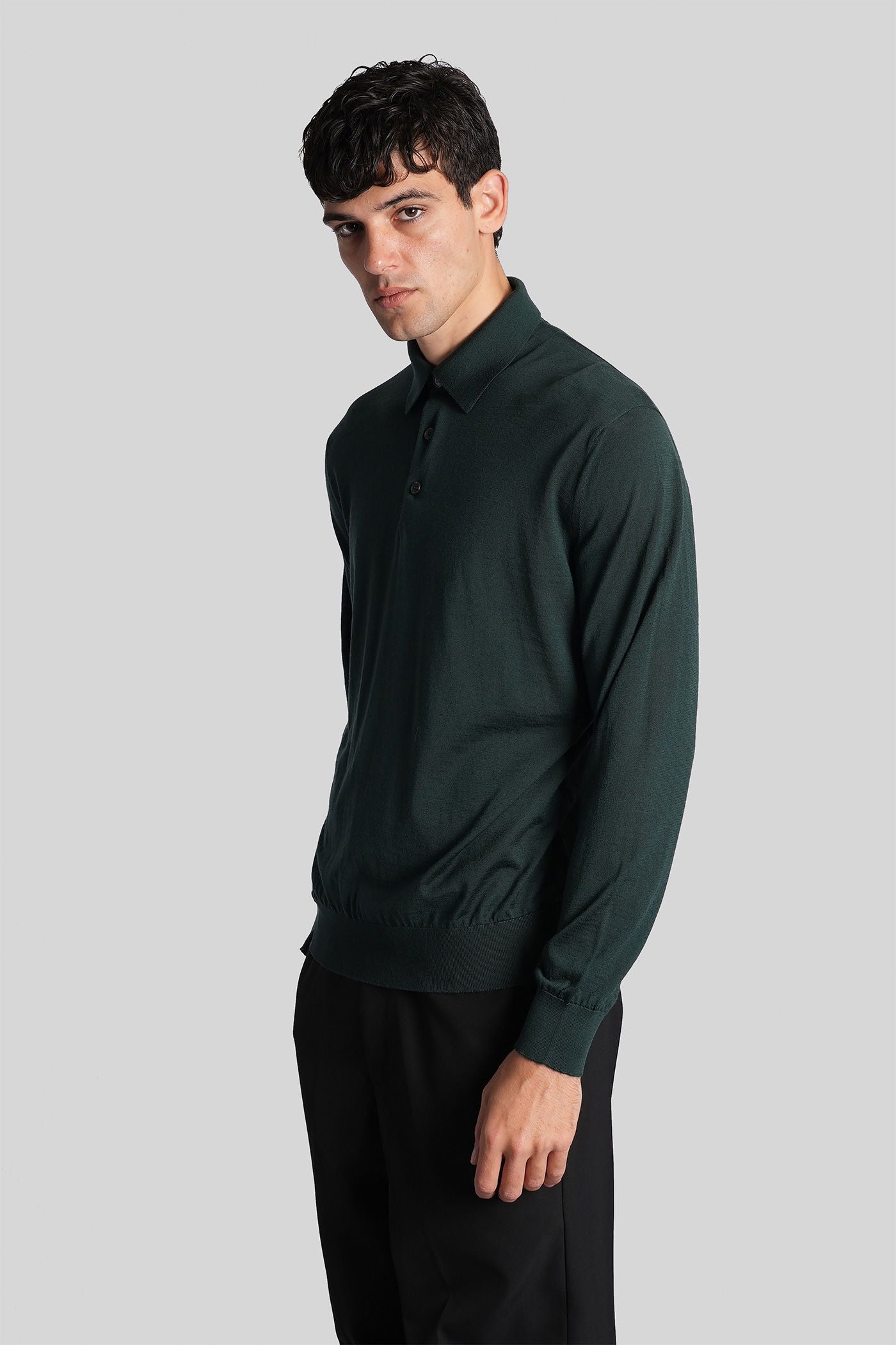 Polo in green wool